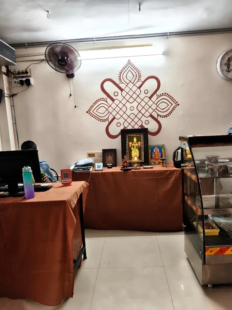 Reception area with traditional kolam wall art
